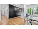 Well-lit dining area with hardwood floors, stylish light fixture, and large window views at 4366 Skyland Ne Dr, Atlanta, GA 30342