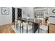 Dining room featuring hardwood floors, modern decor, with views to other living spaces at 4366 Skyland Ne Dr, Atlanta, GA 30342