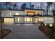 Contemporary-style home featuring a well-lit driveway and inviting entrance at 4366 Skyland Ne Dr, Atlanta, GA 30342