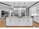 Kitchen featuring a large island with bar seating, stainless steel appliances, and hardwood floors at 4366 Skyland Ne Dr, Atlanta, GA 30342