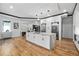 Open-concept kitchen with large center island, modern appliances, and hardwood floors at 4366 Skyland Ne Dr, Atlanta, GA 30342