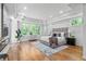 Bright main bedroom with hardwood floors, large windows, and tray ceiling at 4366 Skyland Ne Dr, Atlanta, GA 30342