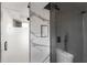 Modern bathroom with a glass shower door and gray tiling at 4366 Skyland Ne Dr, Atlanta, GA 30342