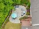 Aerial shot of patio with elegant outdoor seating, dining area, and lush landscaping at 5040 Winding Branch Dr, Dunwoody, GA 30338