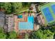 Aerial view of a community pool and tennis courts, a great place to relax and unwind at 5040 Winding Branch Dr, Dunwoody, GA 30338
