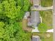 An aerial view of a house with a well-manicured lawn and patio at 5040 Winding Branch Dr, Dunwoody, GA 30338
