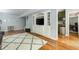 Finished basement with built-in media center, shelving, and adjacent kitchenette at 5040 Winding Branch Dr, Dunwoody, GA 30338