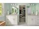 Dual vanity bathroom with white cabinets, large mirrors, and a spacious walk-in closet at 5040 Winding Branch Dr, Dunwoody, GA 30338