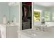 Bathroom with dual vanities, granite countertop, and a view into the walk-in closet at 5040 Winding Branch Dr, Dunwoody, GA 30338