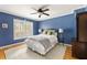 Bedroom with a large window, hardwood floors, and neutral-colored furniture at 5040 Winding Branch Dr, Dunwoody, GA 30338