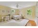 Bright bedroom with hardwood flooring, a desk, and natural light at 5040 Winding Branch Dr, Dunwoody, GA 30338