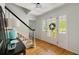 Elegant foyer with hardwood floors, staircase, and decorative details at 5040 Winding Branch Dr, Dunwoody, GA 30338