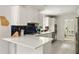 Bright kitchen with white countertops, navy backsplash, and stainless steel appliances at 5040 Winding Branch Dr, Dunwoody, GA 30338