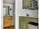 Charming kitchenette featuring a mini fridge, sink, microwave, and unique cabinetry at 5040 Winding Branch Dr, Dunwoody, GA 30338