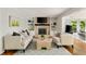 Cozy living room with fireplace, built-in shelves, and comfortable seating at 5040 Winding Branch Dr, Dunwoody, GA 30338