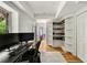 Home office with built in bookshelves and large window providing natural light at 5040 Winding Branch Dr, Dunwoody, GA 30338