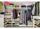 Organized walk-in closet with custom shelving and ample storage space for clothes and shoes at 5040 Winding Branch Dr, Dunwoody, GA 30338
