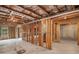 Unfinished basement with exposed studs, beams, concrete floors, and a partial window at 881 Springs Crest Dr, Dallas, GA 30157