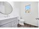 Modern bathroom with stylish vanity, updated fixtures, and wood-look flooring at 881 Springs Crest Dr, Dallas, GA 30157