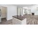 Open concept kitchen with stainless steel appliances, granite countertops, and a pantry at 881 Springs Crest Dr, Dallas, GA 30157