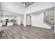 Open-concept layout featuring bright kitchen and living room with hardwood floors and ample space at 881 Springs Crest Dr, Dallas, GA 30157