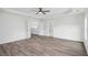 Spacious main bedroom with wood look floors and a ceiling fan at 881 Springs Crest Dr, Dallas, GA 30157