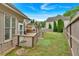 Spacious backyard featuring a patio with an outdoor kitchen and lush green grass at 900 Fox Croft Pl, Canton, GA 30114