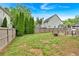 Fenced backyard featuring lush greenery and providing a private and secure outdoor space at 900 Fox Croft Pl, Canton, GA 30114