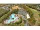 Aerial view features a pool, golf course, playground, parking, walking trails, and open space for outdoor activities at 900 Fox Croft Pl, Canton, GA 30114