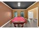 Game room with pool table, black ceiling and natural light at 900 Fox Croft Pl, Canton, GA 30114