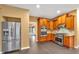 Kitchen featuring stainless steel appliances, wood cabinets, and granite countertops at 900 Fox Croft Pl, Canton, GA 30114