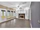 Spacious living room featuring a fireplace, built-in shelving, and hardwood floors at 900 Fox Croft Pl, Canton, GA 30114