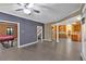 Bright living room with dark accent wall open to the kitchen and recreational room with a pool table at 900 Fox Croft Pl, Canton, GA 30114