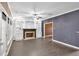 Living room with a fireplace, built-in shelving, and access to the sunroom at 900 Fox Croft Pl, Canton, GA 30114