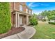 Welcoming front porch of a brick home with landscaped walkway at 900 Fox Croft Pl, Canton, GA 30114