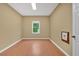 Bright, airy room with gleaming floors, offering a versatile space for any purpose at 900 Fox Croft Pl, Canton, GA 30114