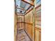 This outdoor shower features wood construction, a rain shower head, and a teak bench at 900 Fox Croft Pl, Canton, GA 30114