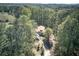 Aerial view of the home surrounded by a forest landscape, providing a secluded and private setting at 2528 Mulberry Rock Rd, Dallas, GA 30157