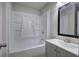 Bathroom with bathtub and shower, sink with vanity, and black framed mirror at 2528 Mulberry Rock Rd, Dallas, GA 30157