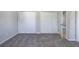 Bedroom featuring gray carpet with double door closets and gray walls at 2528 Mulberry Rock Rd, Dallas, GA 30157