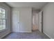 Bedroom featuring gray carpet, light walls, large window, and a closet at 2528 Mulberry Rock Rd, Dallas, GA 30157
