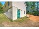 Exterior of the home featuring a full basement and a utility door at 2528 Mulberry Rock Rd, Dallas, GA 30157