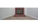 Close-up of a cozy brick fireplace with hearth and modern flooring at 2528 Mulberry Rock Rd, Dallas, GA 30157