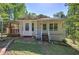 Charming one-story home with a covered porch and lush landscaping at 2528 Mulberry Rock Rd, Dallas, GA 30157