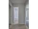 Hallway with wood-look flooring leading to a bathroom and bedroom at 2528 Mulberry Rock Rd, Dallas, GA 30157