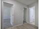 Hallway showing access to bedrooms and bathroom, with modern flooring and neutral paint at 2528 Mulberry Rock Rd, Dallas, GA 30157