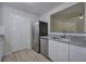Modern kitchen with stainless steel appliances, granite countertops, and white cabinets at 2528 Mulberry Rock Rd, Dallas, GA 30157