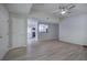 Bright living room with ceiling fan, wood-look flooring, and an open view to the kitchen at 2528 Mulberry Rock Rd, Dallas, GA 30157