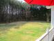 Serene backyard with a wooded view, offering privacy and a tranquil outdoor space for relaxation and enjoyment at 28 County Line #2 Rd, Rydal, GA 30171