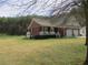 Charming brick home featuring a two-car garage and inviting front porch at 28 County Line #2 Rd, Rydal, GA 30171